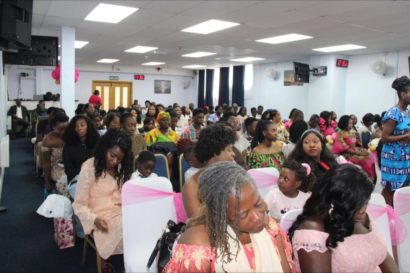 Families seated together at a celebration service