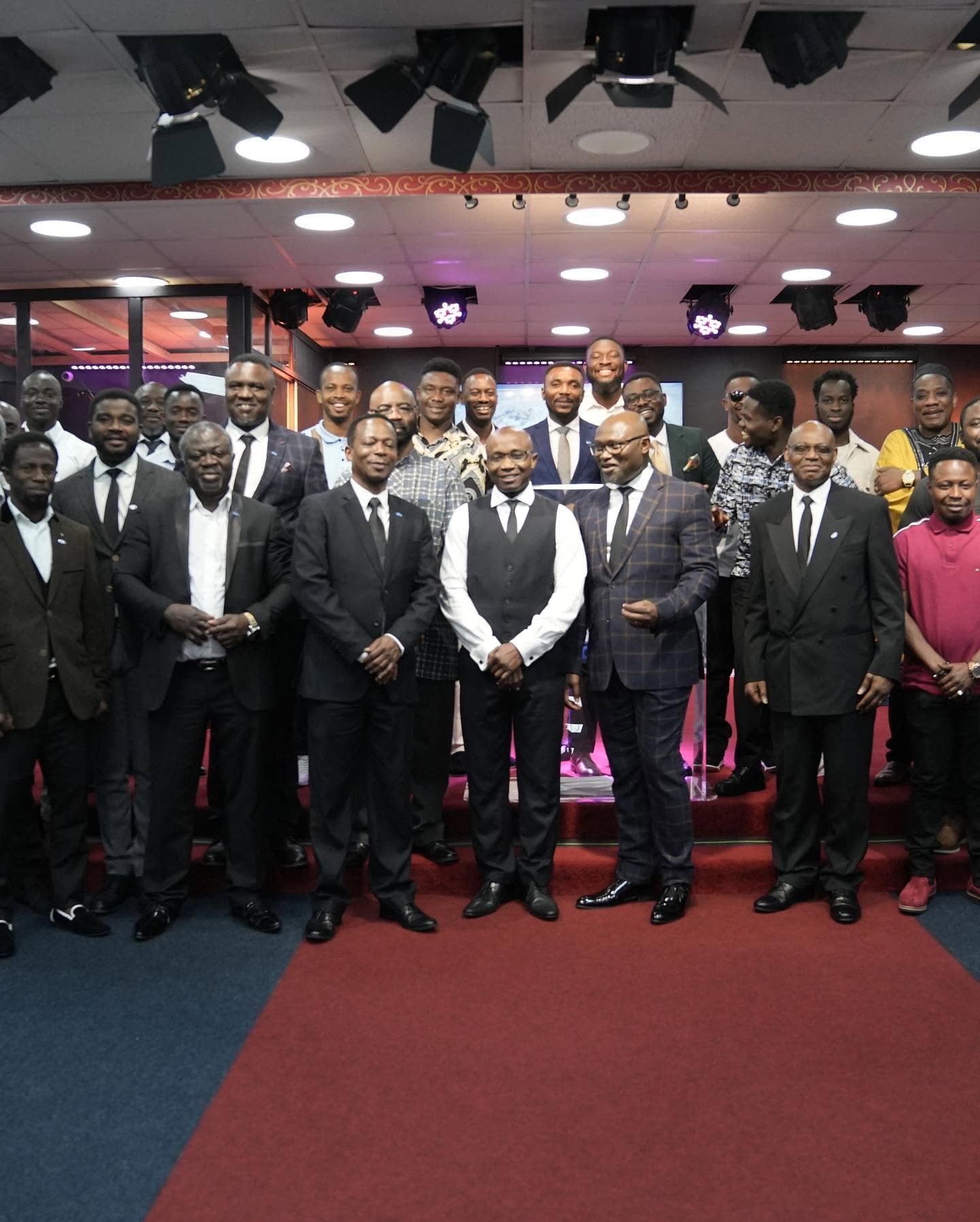 The men of ICC gathered on stage after a fellowship service