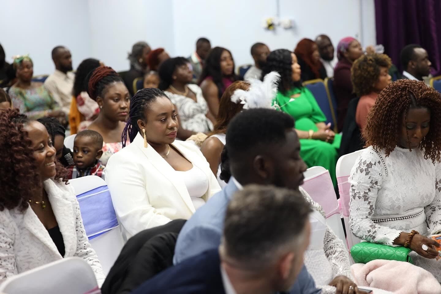 Guests of every generation seated together at a blessing service